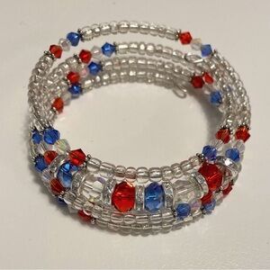 Hand Crafted Clear Coil Bracelet with Red & Blue Accents